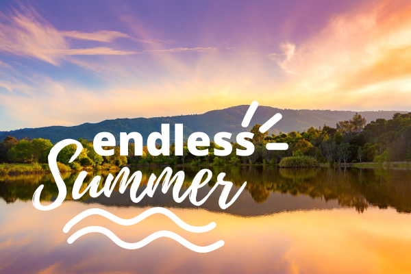 A serene lakeside landscape under a colorful evening sky with the text 